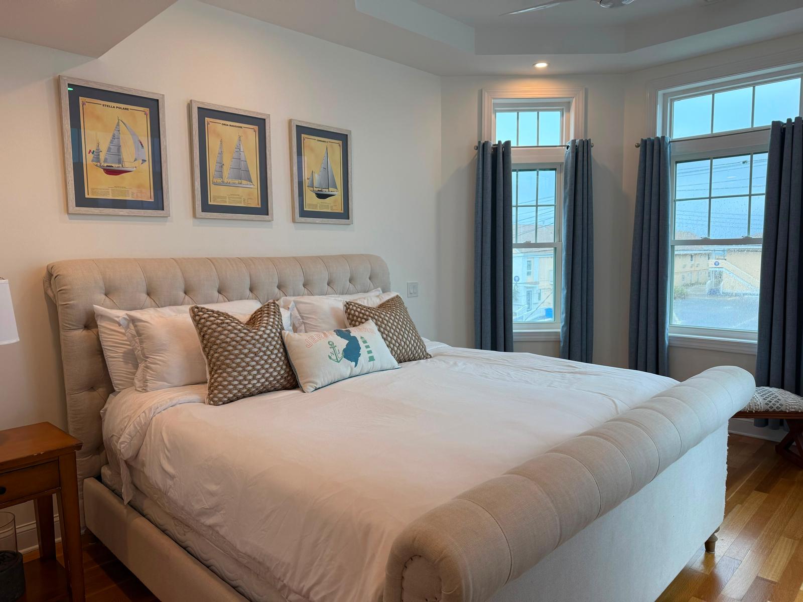 Crisp white bedding and tufted headboard