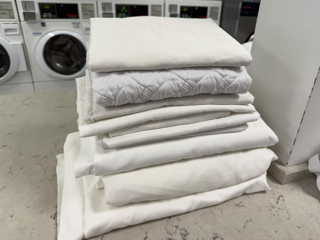 Stack of freshly laundered white sheets