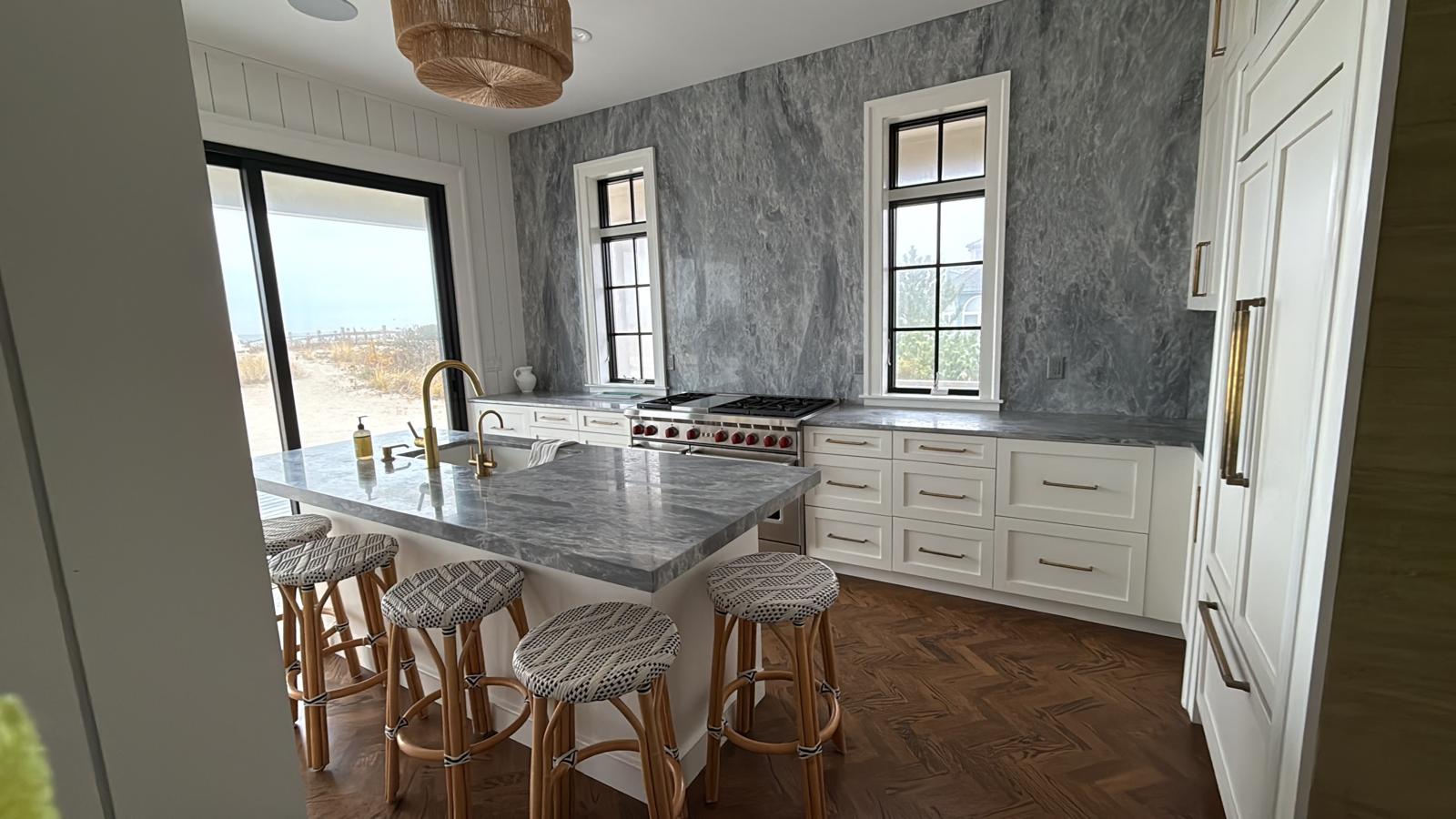 Beachfront kitchen with marble surfaces and brass fixtures
